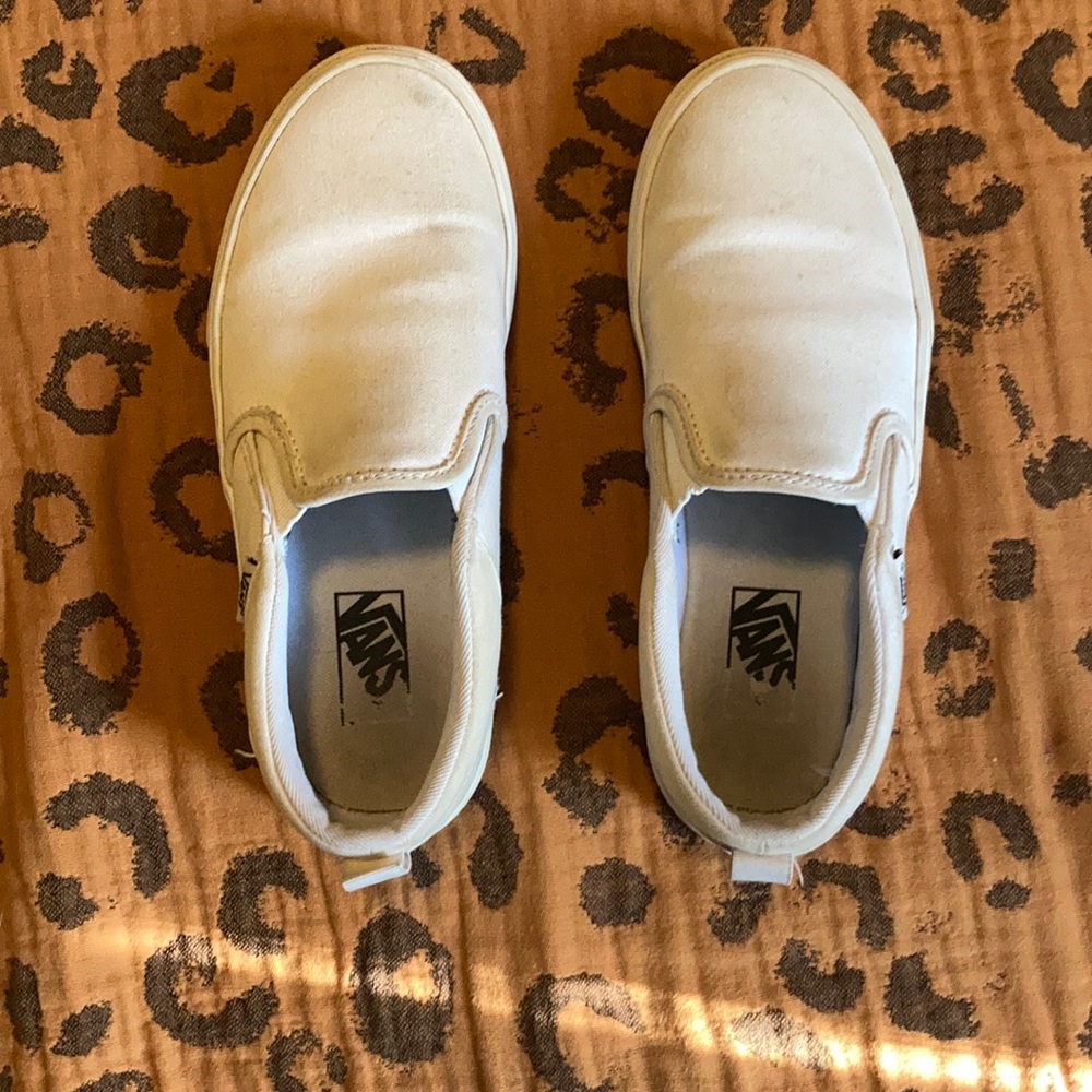 Vans unisex big kids size 3.0 white slip ons.